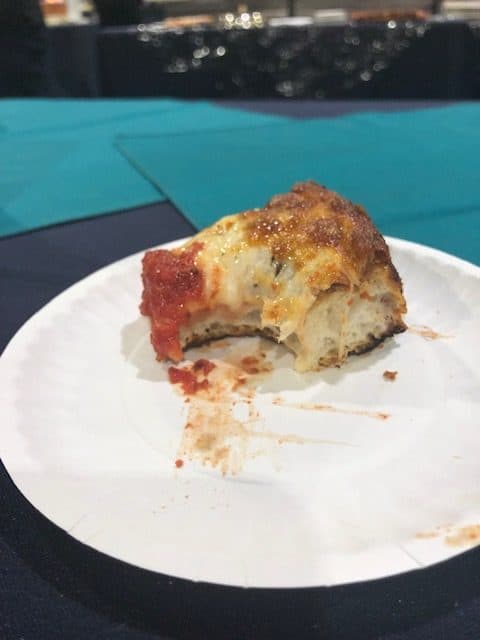 Delicious slice of a deep-dish-pizza cooked in a Hot Rocks oven